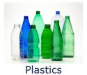 Photo of several bottles of different shapes standing next to each other - all made from plastic